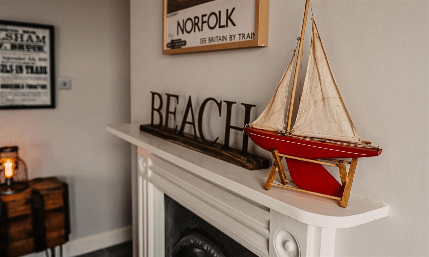 Deluxe Sea View Bedroom at The Ship Inn with fireplace, boat ornament and Beach sign