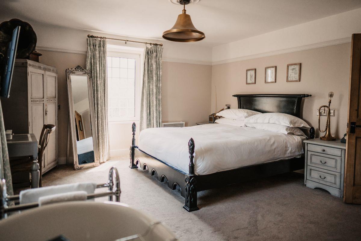 Luxurious looking bedroom filled with natural light