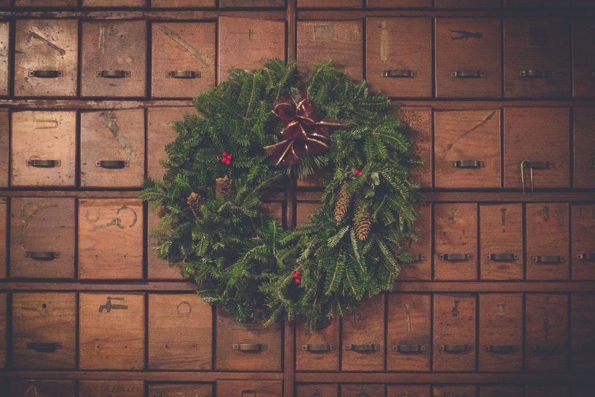 Christmas wreath hanging on vintage draws
