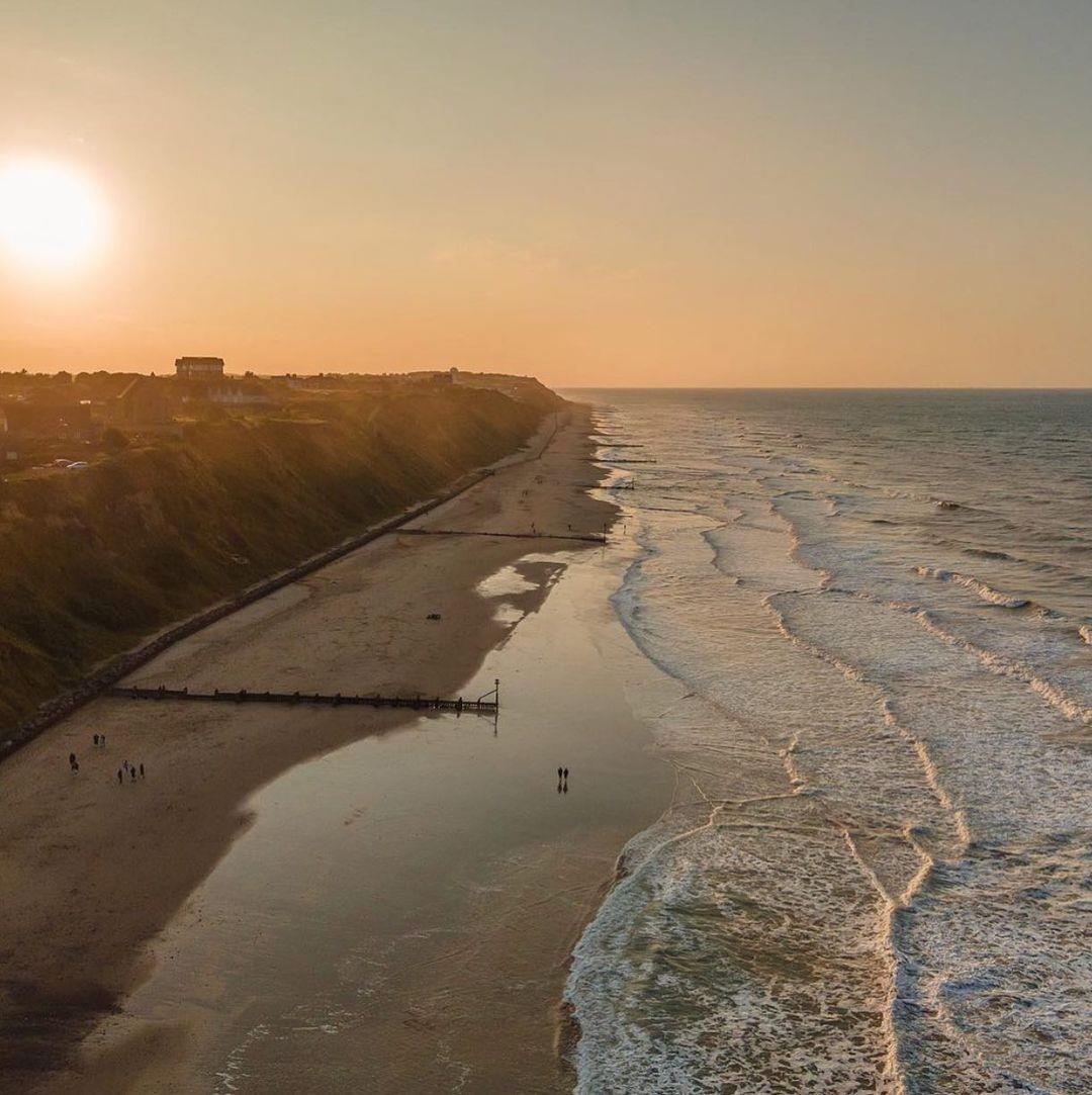 Beach in Norfolk with sea and sunset
