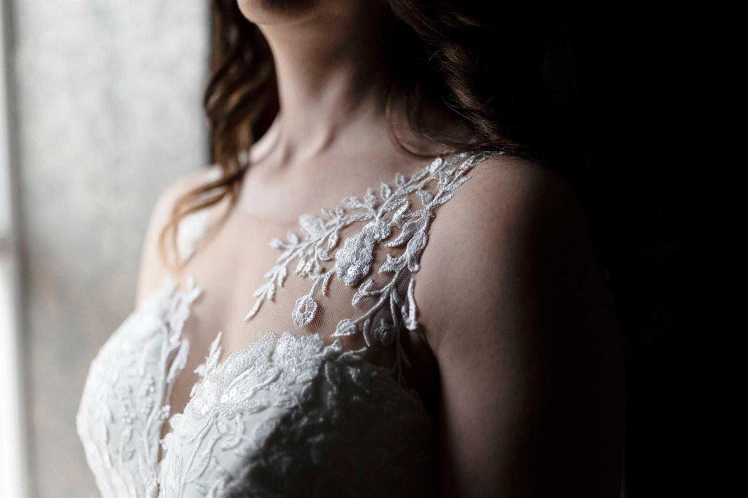 Close up picture of a bride wearing a gown
