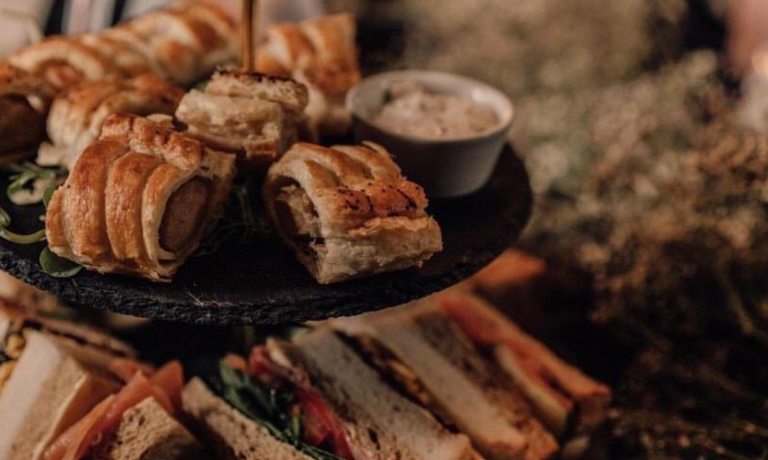 Afternoon Tea with sausage rolls and sandwiches 