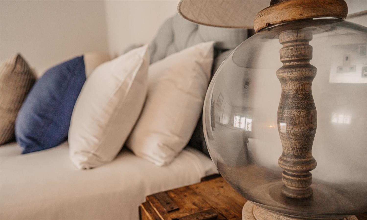 Premium Double Bedroom at Ship Inn with lamp and cushions