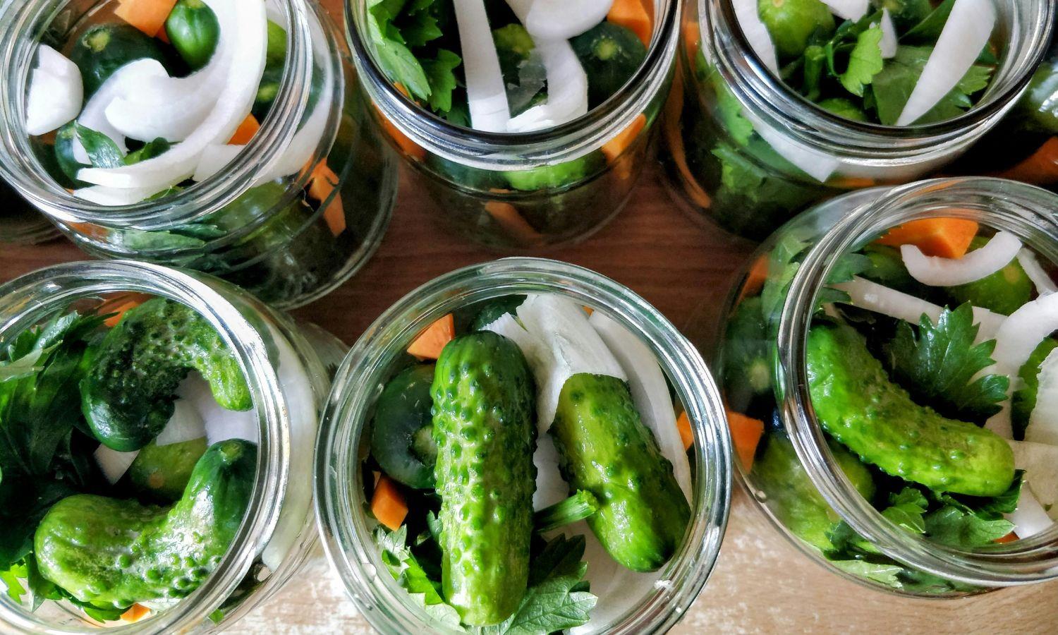 Close up of jars full of pickled vegetables
