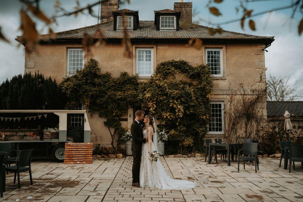 Newly married couple in front of Widbrook Grange