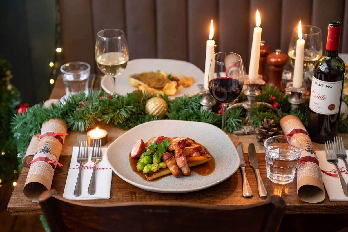 Christmas dinner laid out on a dining table