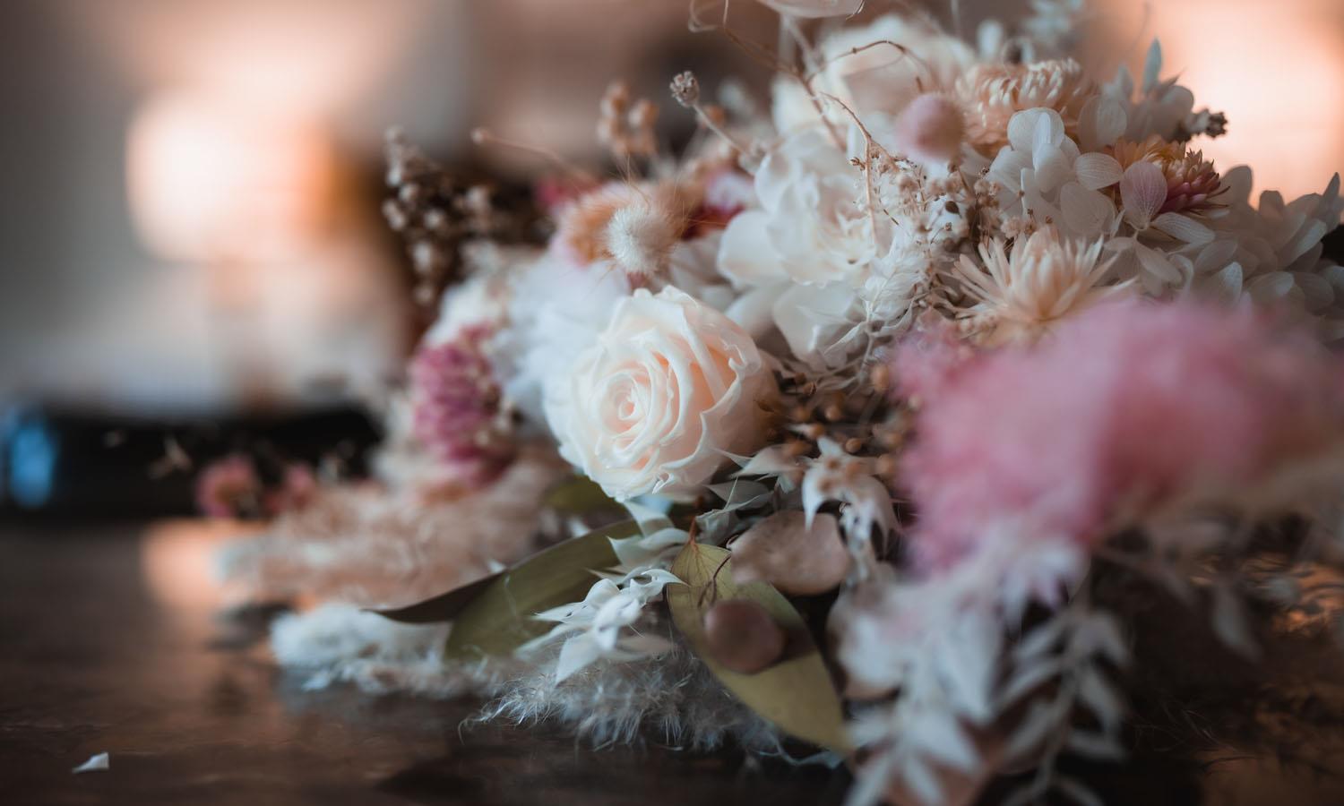 Pink and white bridal flowers on table