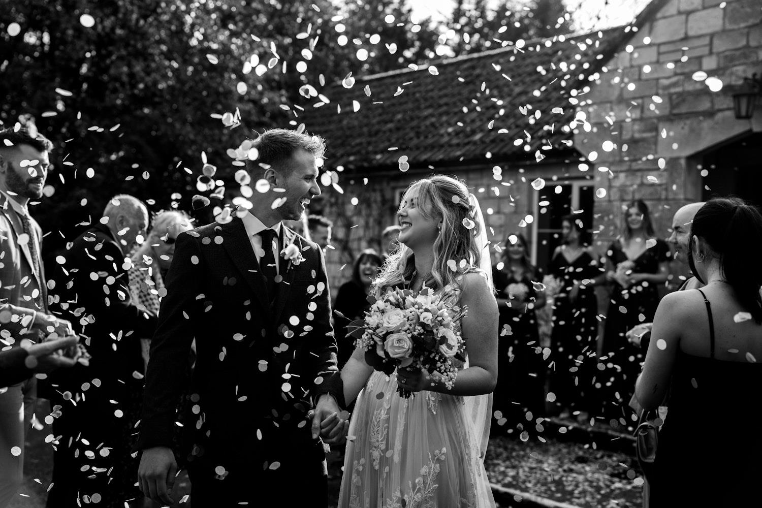Confetti in black and white outisde Widbrook Grange (c) Amber Louise Photography