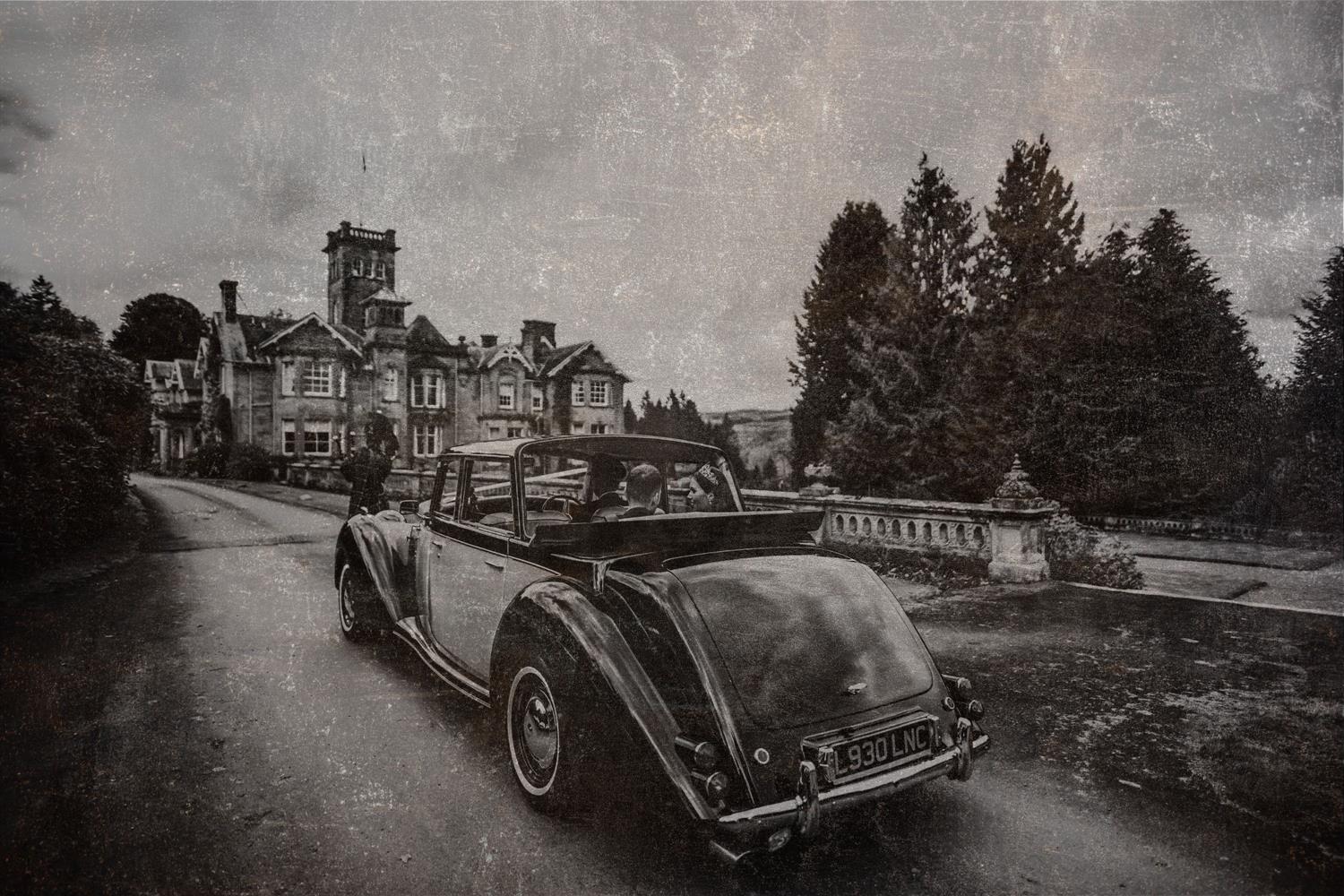 Wedding car on castle drive at Auchen Castle