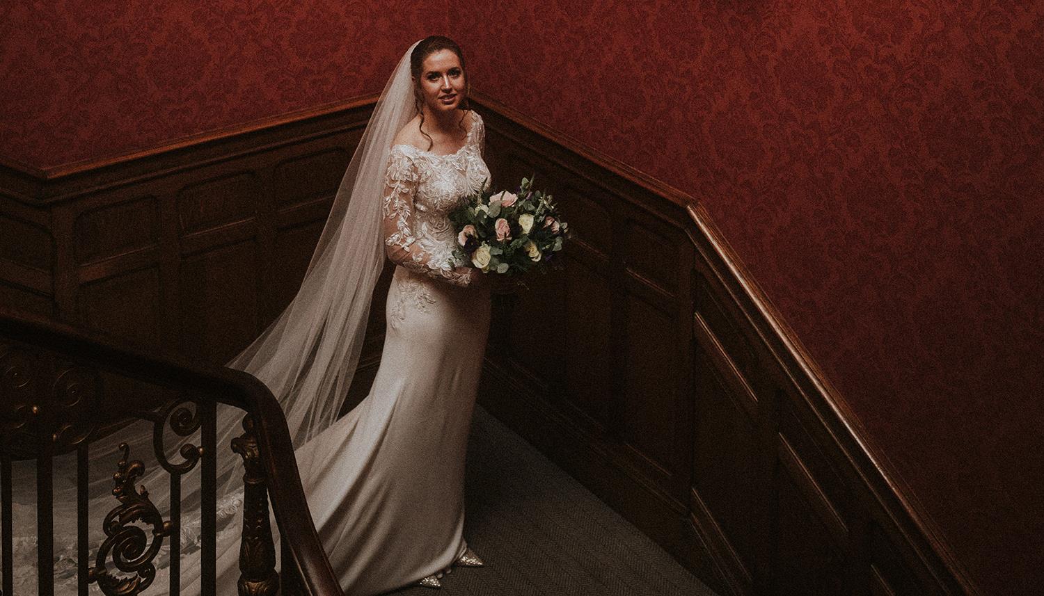 Bride descending stairs. Photo Credit: Bernadeta Kupiec Photography