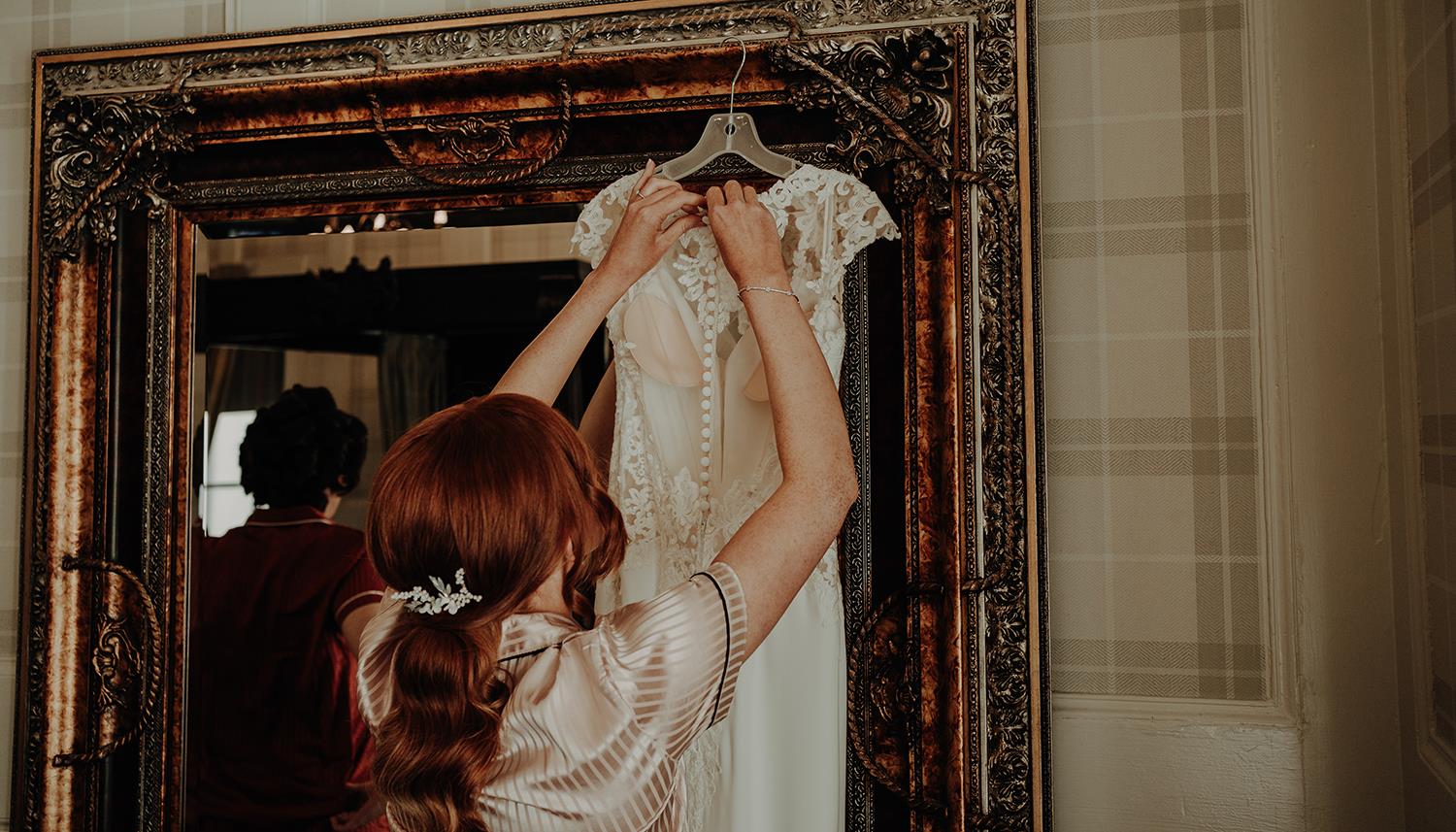 Hanging up dress. Photo Credit: Danielle Leslie Photography