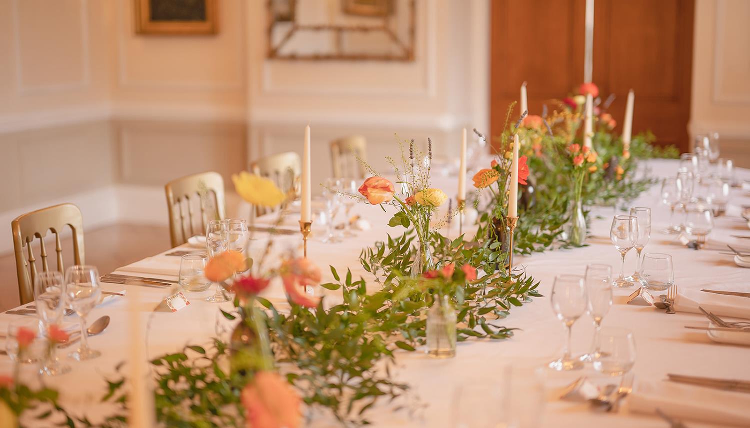 Flowers and candles at the table. Photo Credit: Duncan Ireland Photography