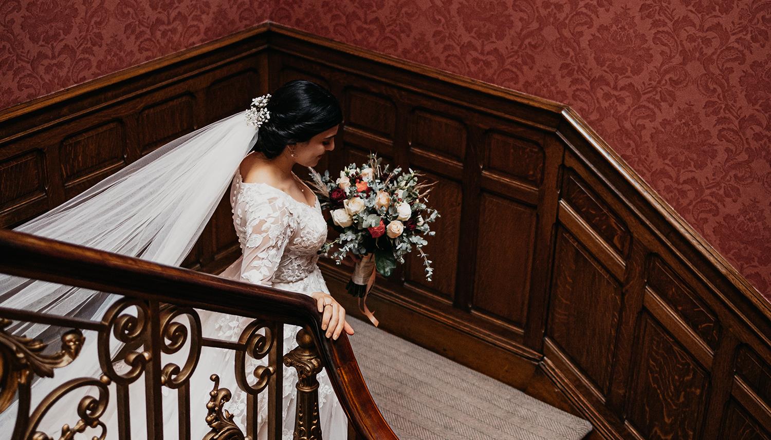 Bride descending stairs. Photo Credit: Mark Keogh Photography