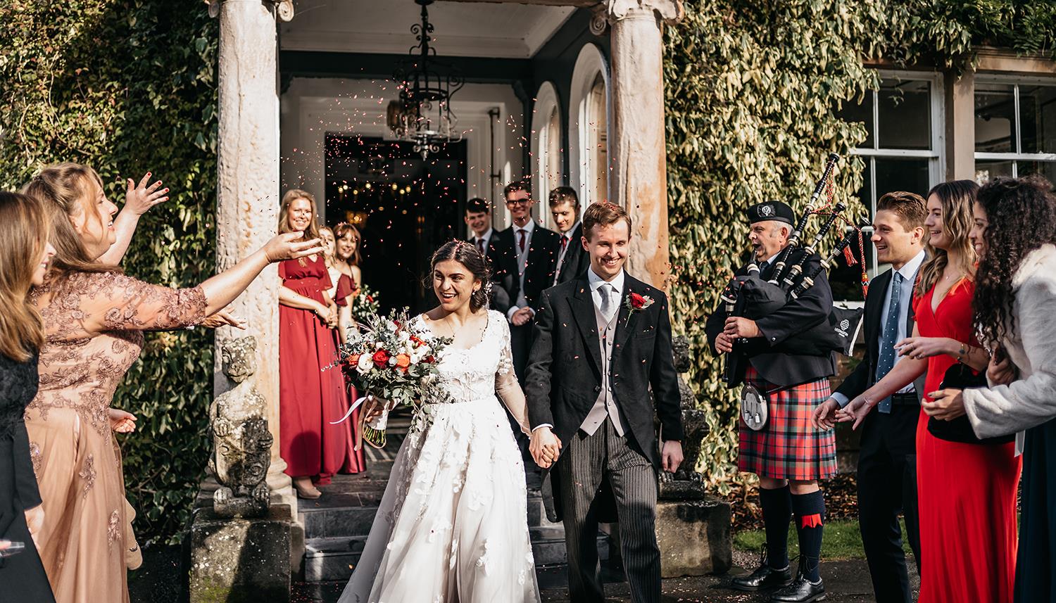 Couple leaving through the entrance. Photo Credit: Mark Keogh Photography