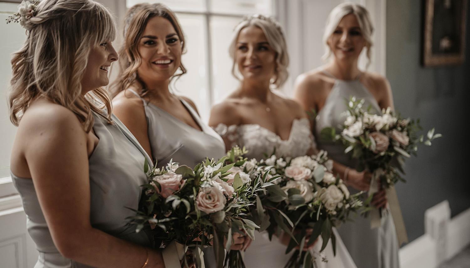 Bridesmaids with flowers. Photo Credit: Willow and Wilde