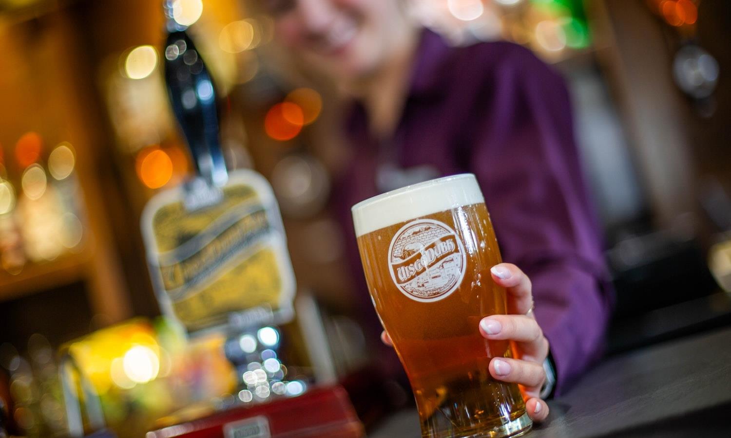 Beer being served by bartender at Kinloch Hotel