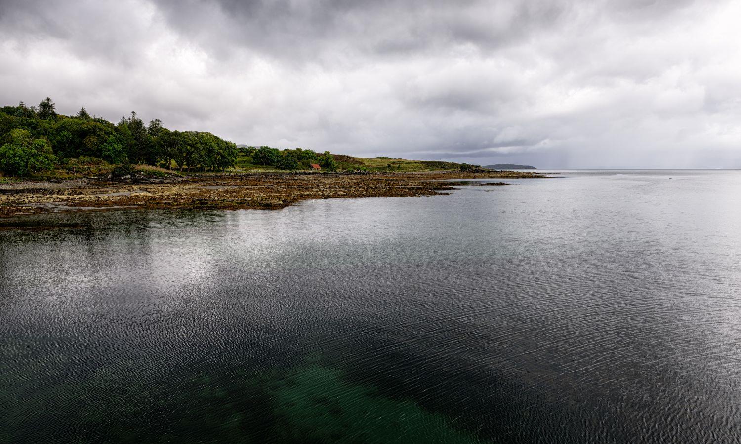 View of a calm Broadford Bay on a cloudy but clear day