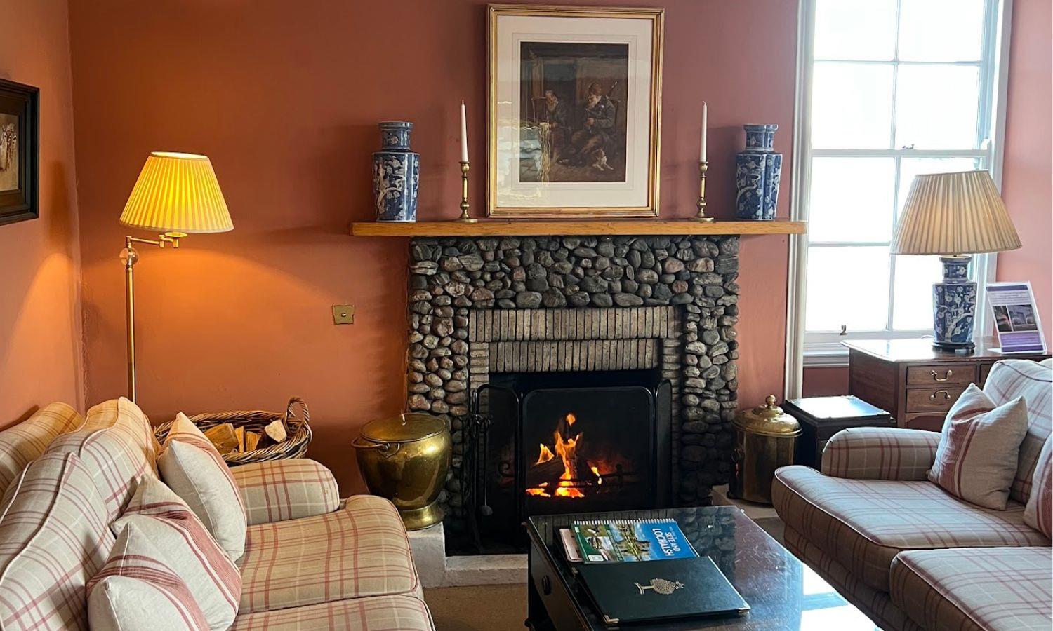 Cosy lounge at Hotel Eilean Iarmain with log fire