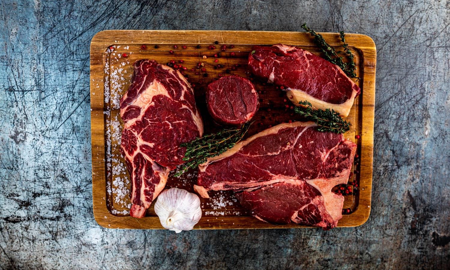 Steaks on a board