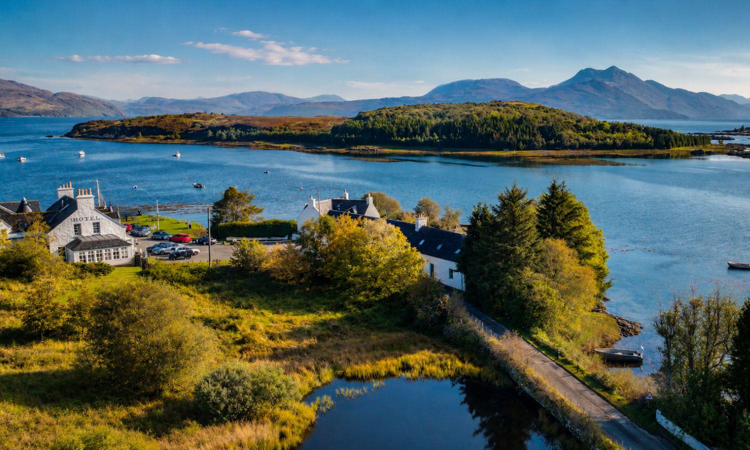 Drone photo of Eilean Iarmain Hotel showing waterside setting overlooking Sound of Sleat