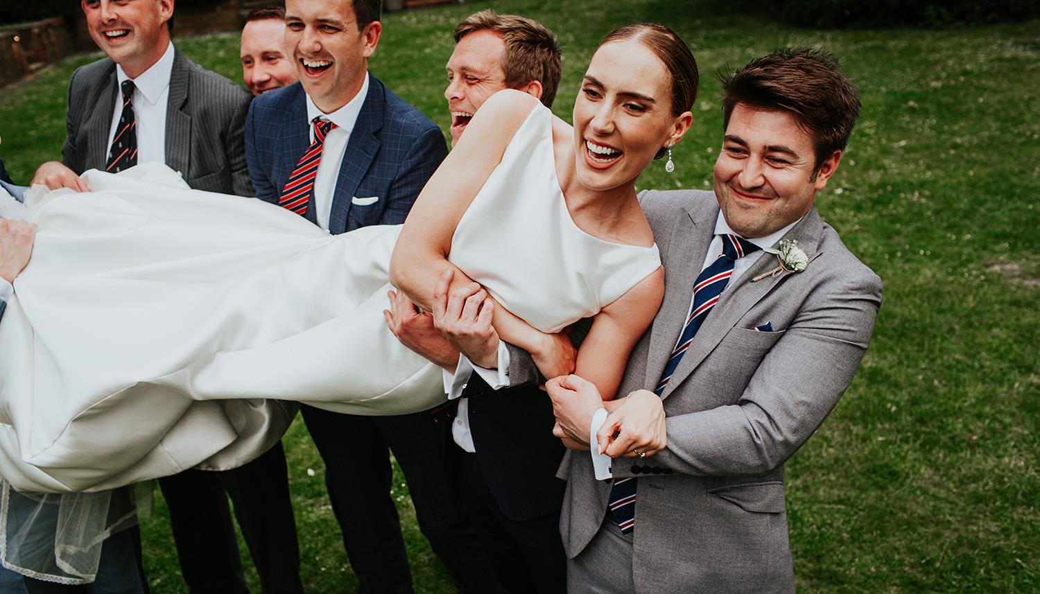 Carrying the bride. Photo Credit: Oxana Mazur Photography