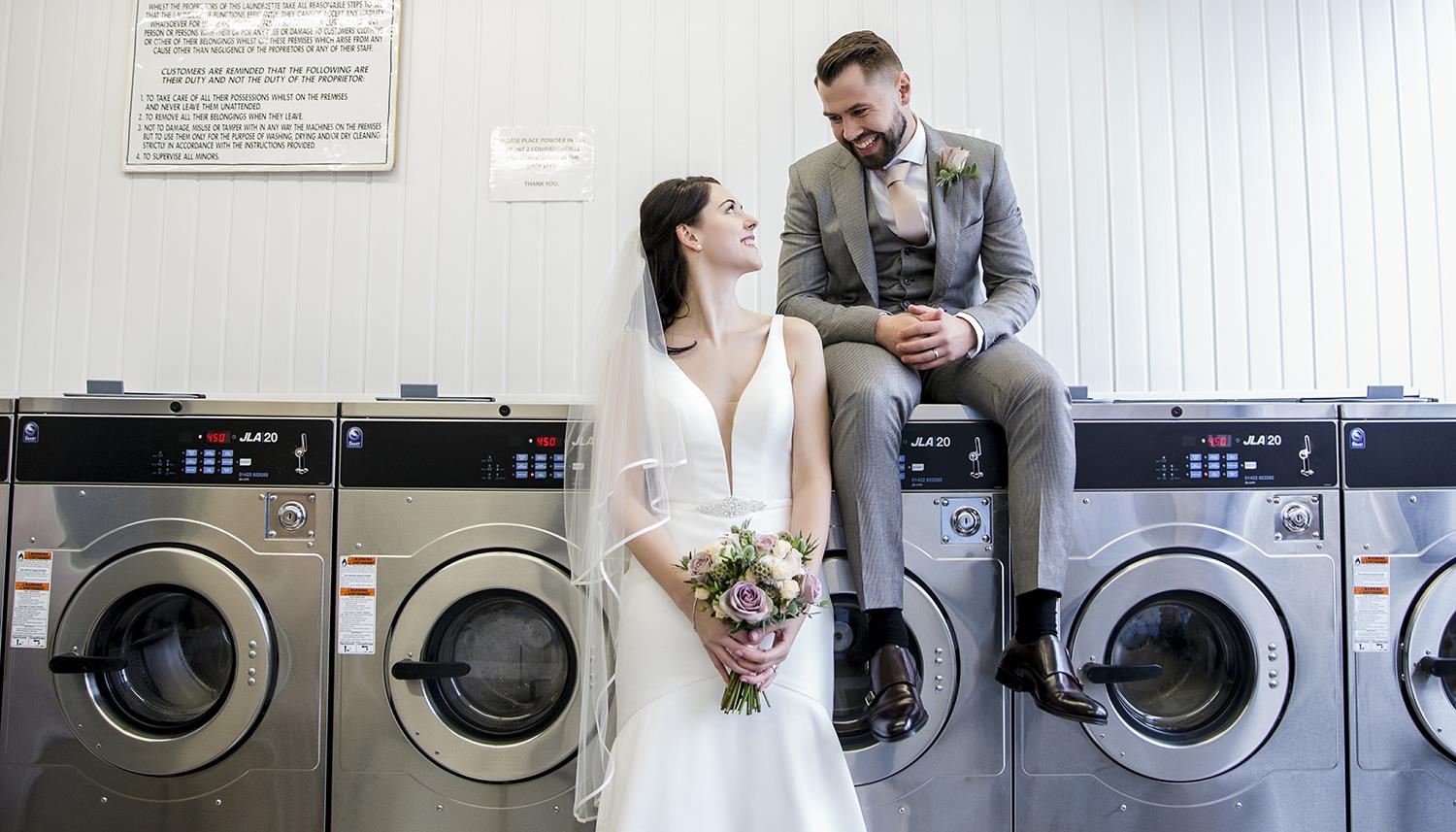 Bride and Groom at the laundromat. Photo Credit: Shell Sperling Photography