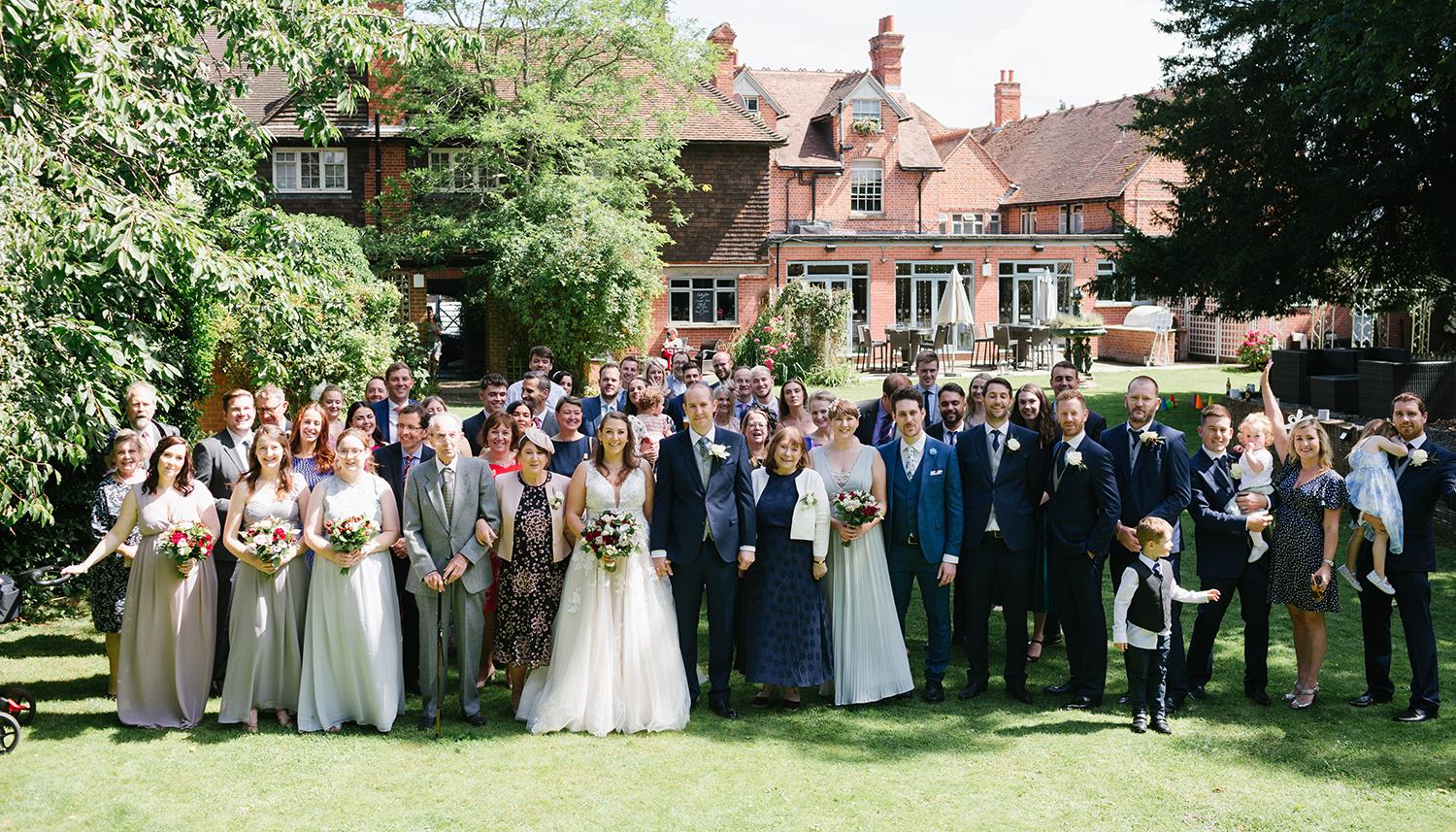 Group shot in the garden. Photo Credit: Ilaria Petrucci Photography