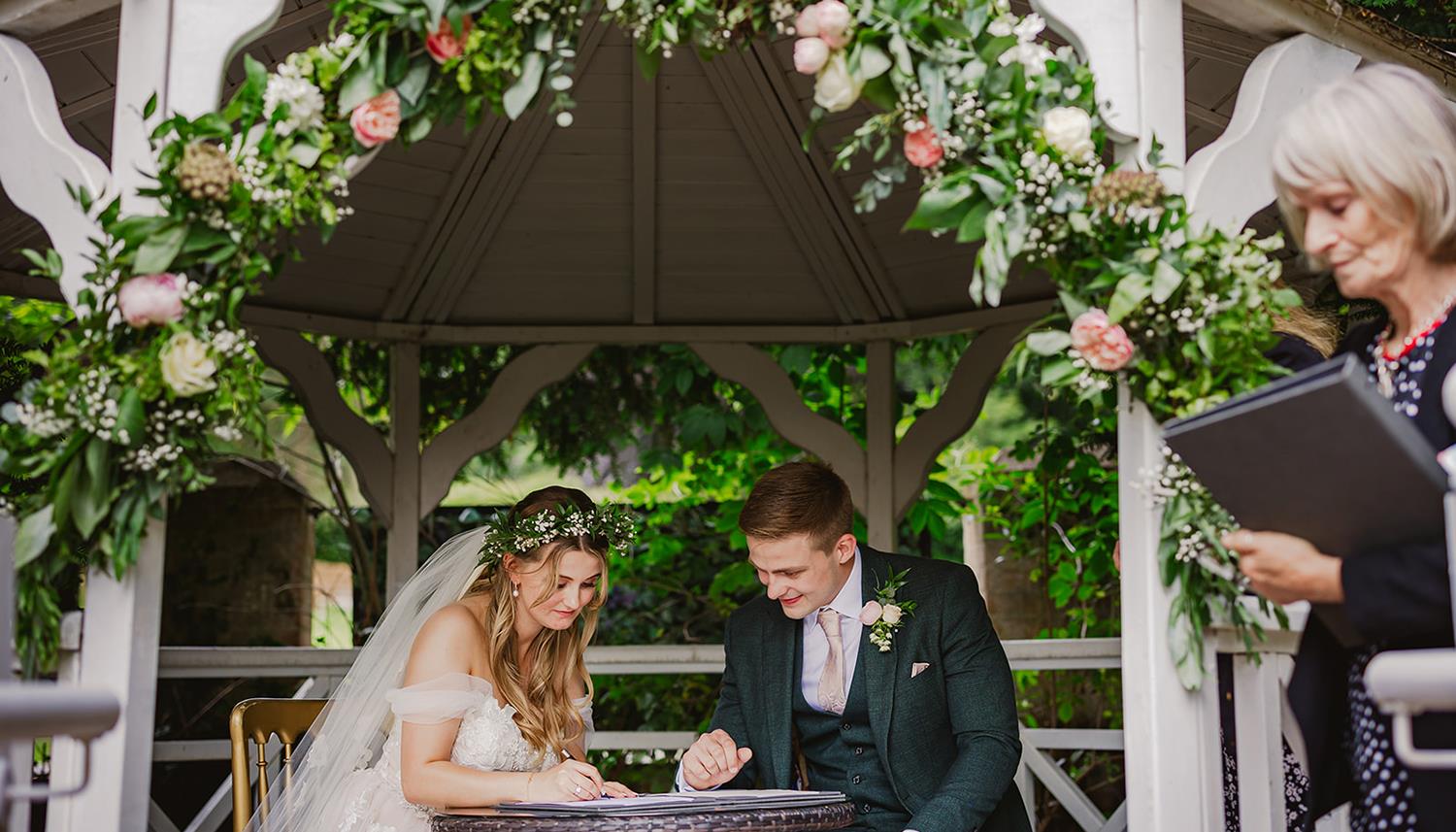 Signing the register. Photo Credit: Philip Quinnell Photography