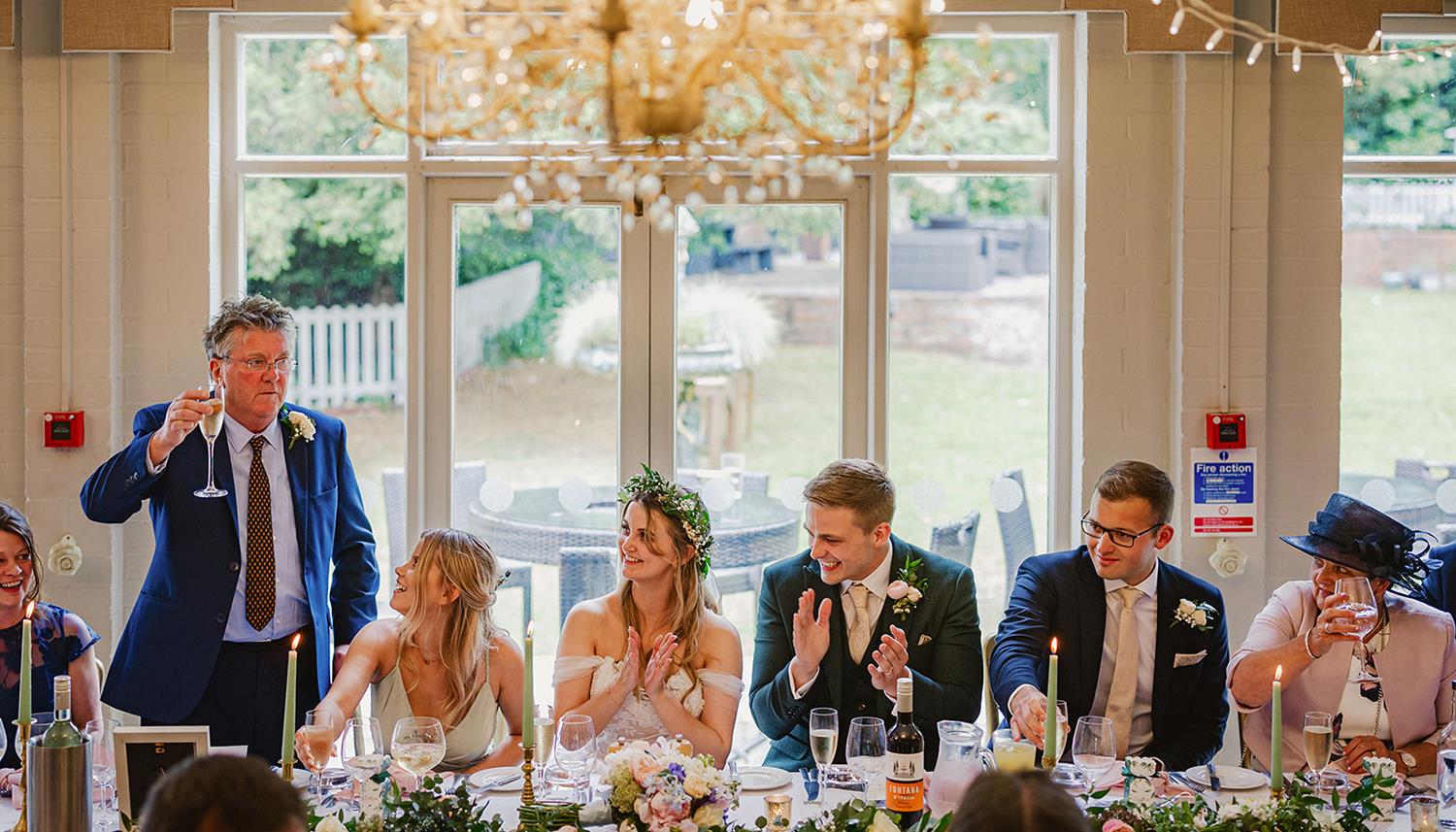 Making a toast. Photo Credit: Philip Quinnell Photography