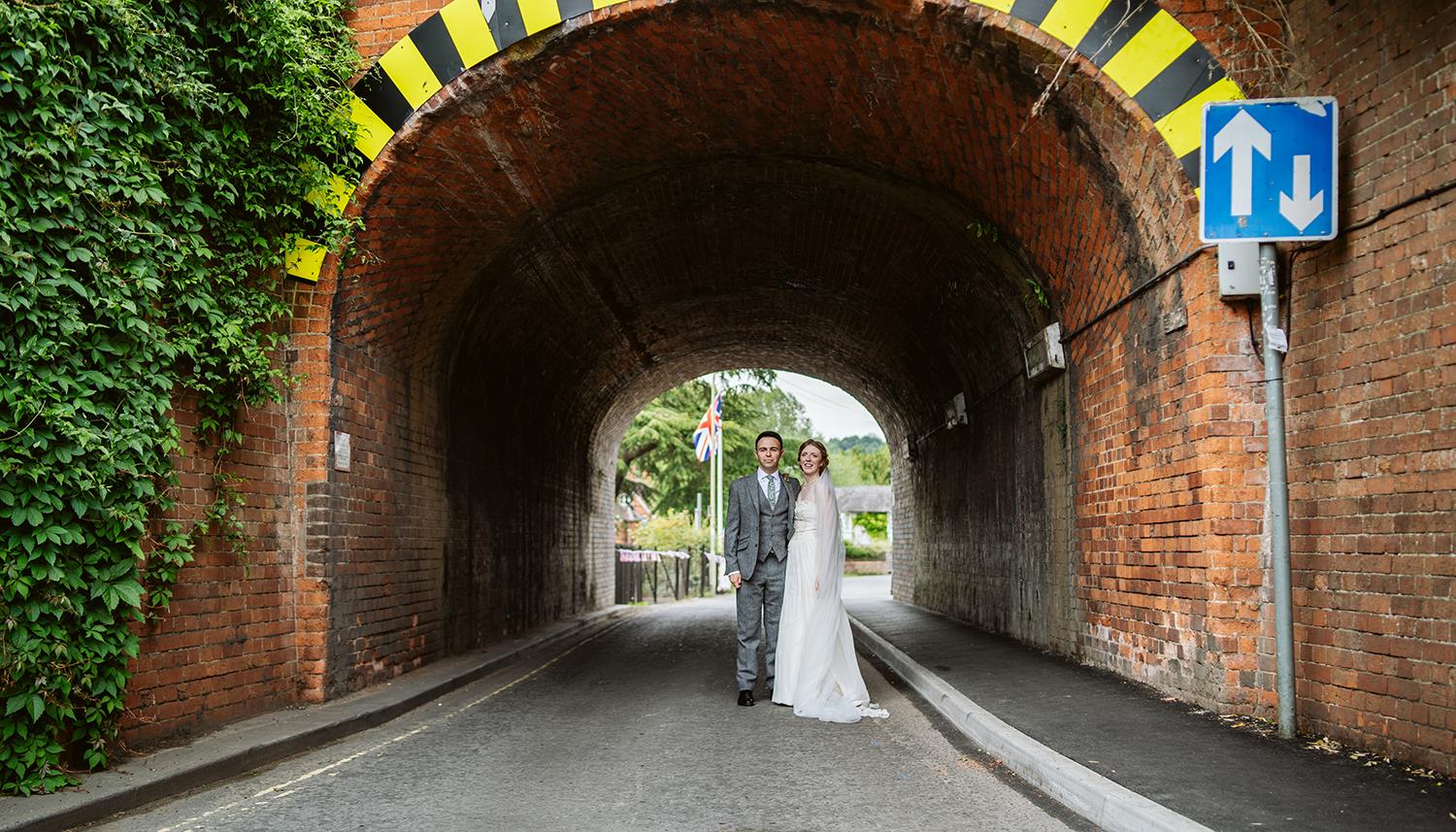 Couple under a bridge. Photo Credit: Lee Dann Photography