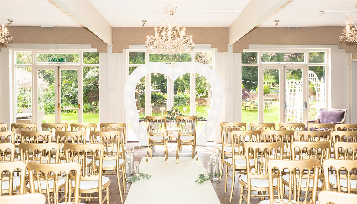 Room ready for ceremony with large windows. Photo Credit: Vevi-photography