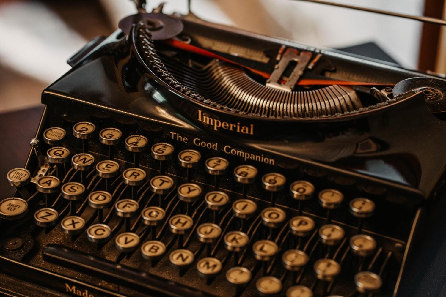 Bedside table with lamp in bedroom at Shieldaig Lodge hotel near Bath