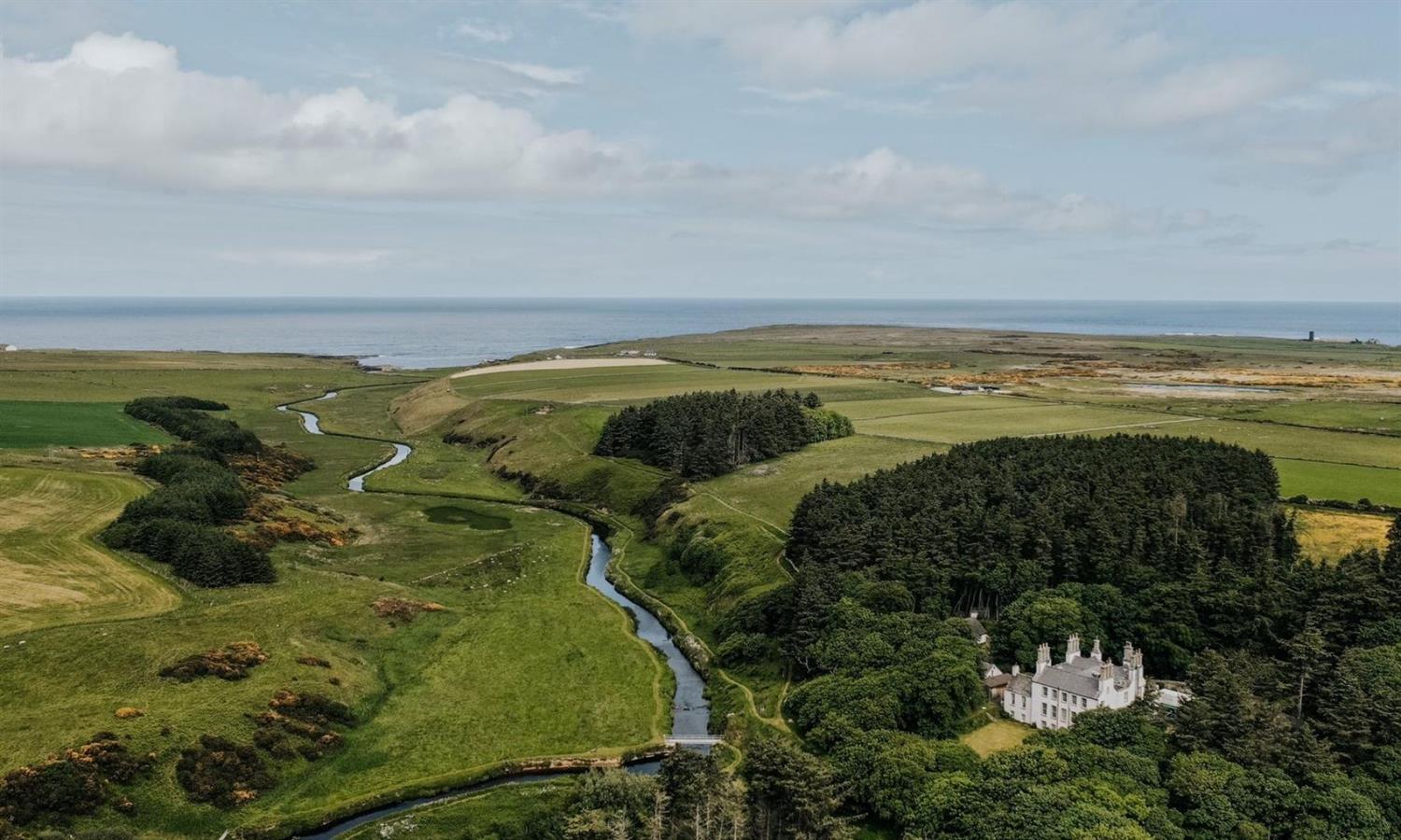 Drone view of Forss House Hotel with views out to sea
