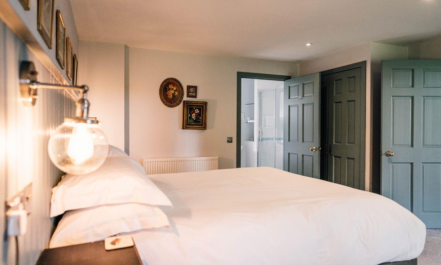 Luxury hotel bedroom with kingsize bed and boutique styling