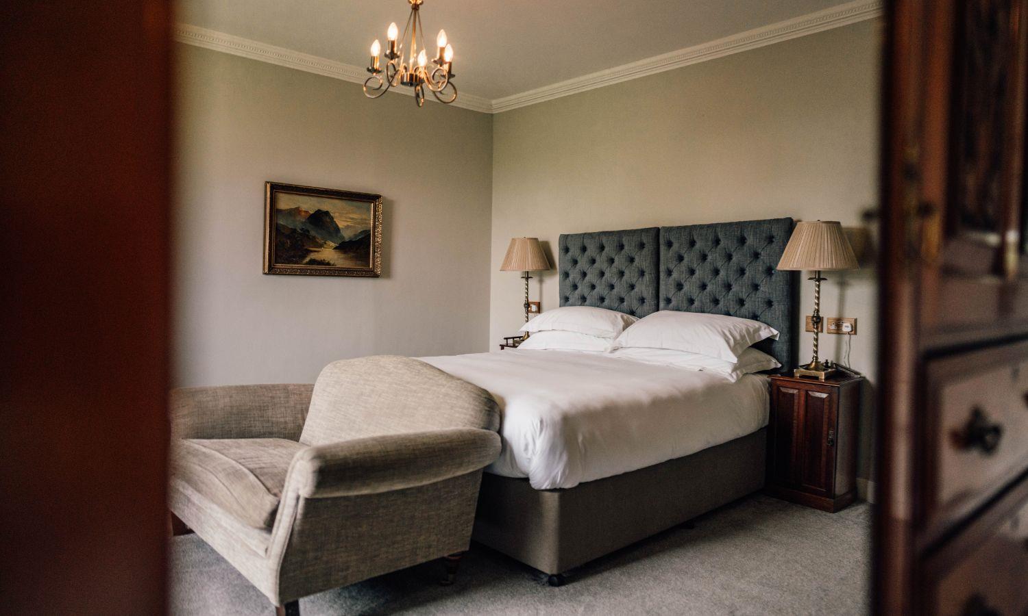 Luxury boutique hotel suite with kingsize bed and sofa
