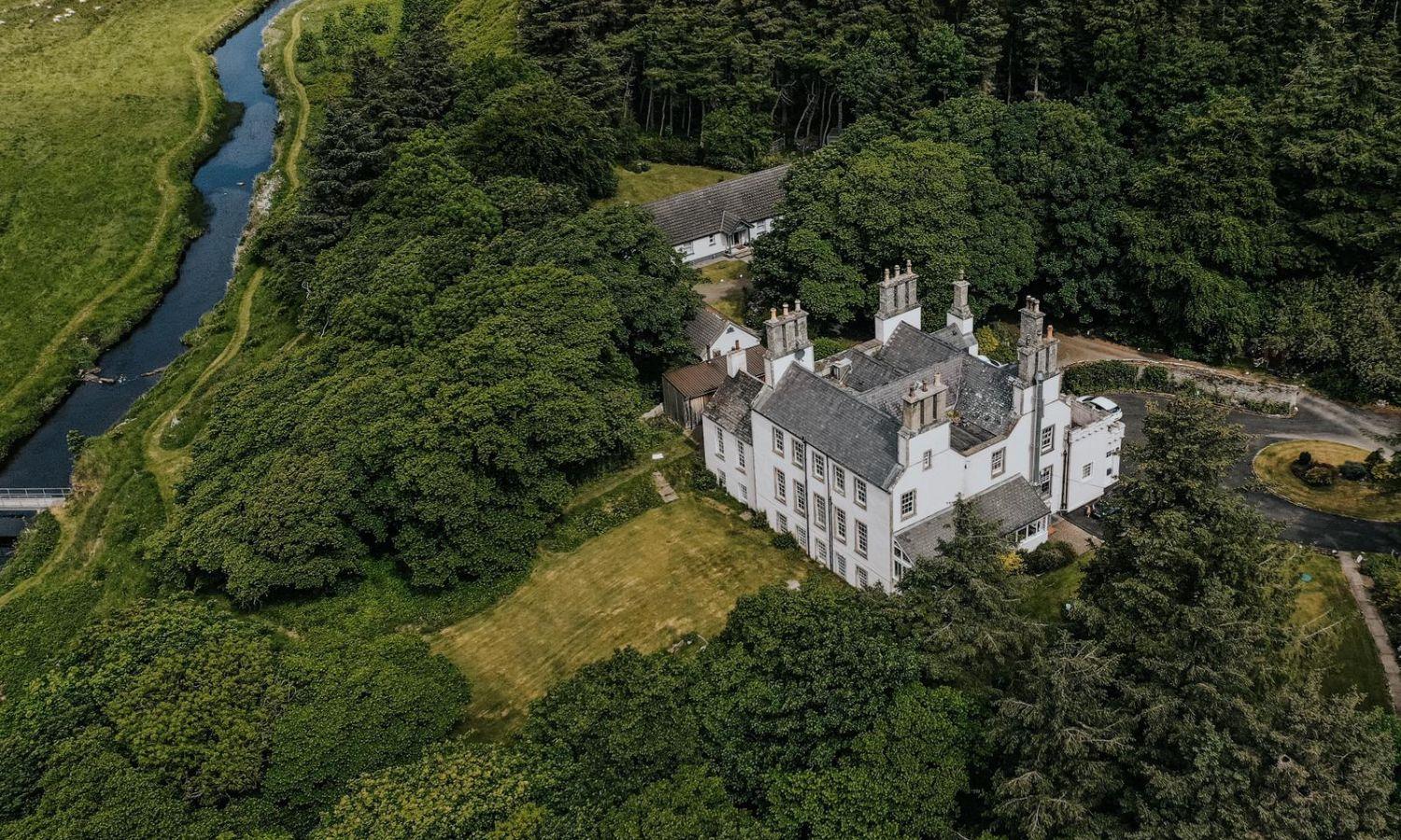 Drone photo of Forss Hotel showing woodland setting