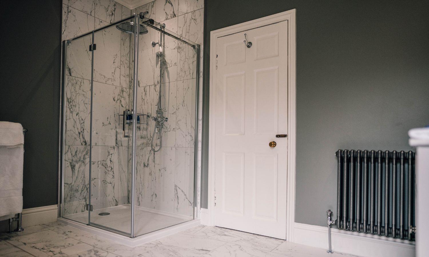 Large shower cubicle in en-suite hotel bathroom