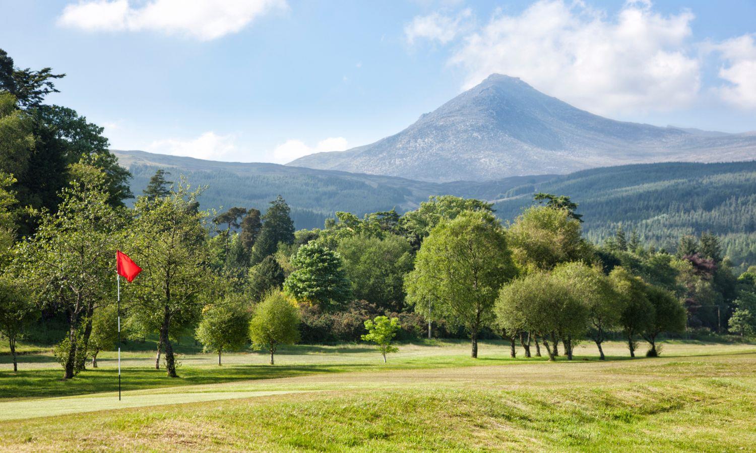 Beautifully manicured green on Shiskine Golf Course with Goat Fell in the distance