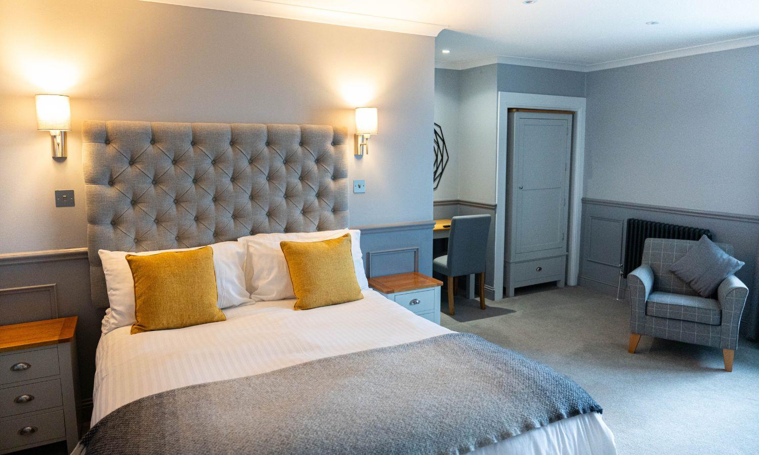 Spacious bedroom at Kinloch Hotel on the Isle of Arran with king-size bed and seating area