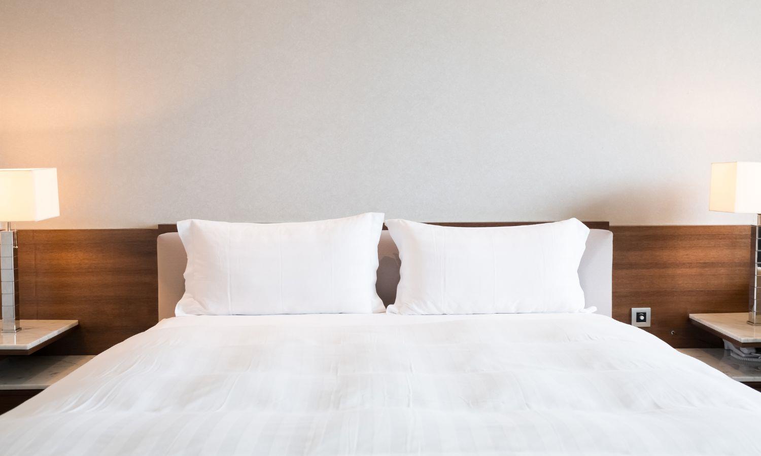 Bed in basic hotel room
