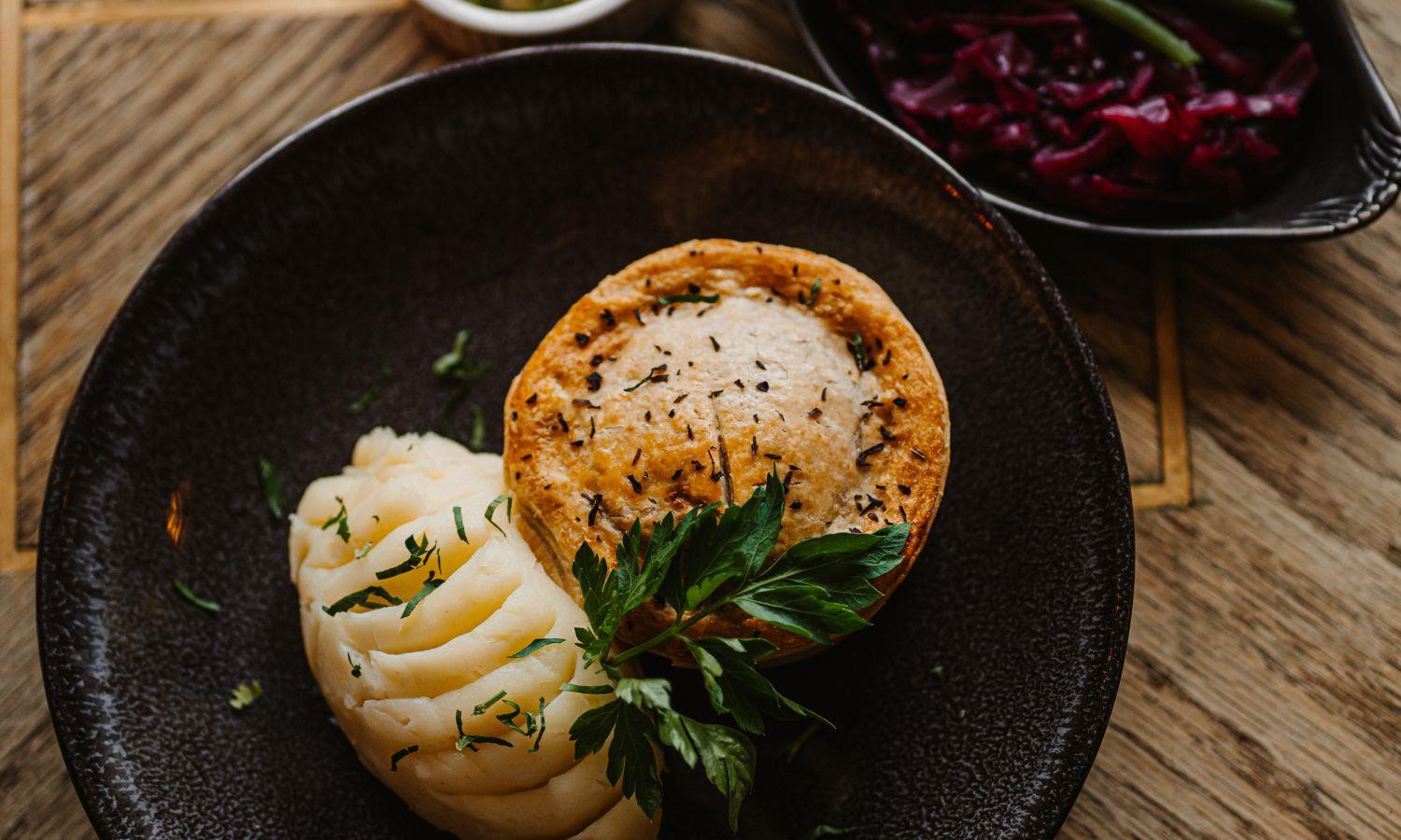 Restaurant table with pie and accompaniments 