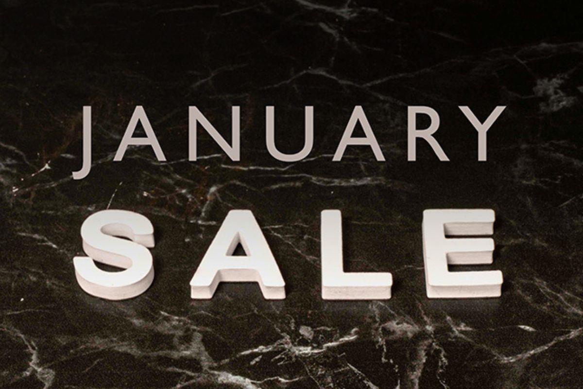 Text reads January Sale on a black and white textured background