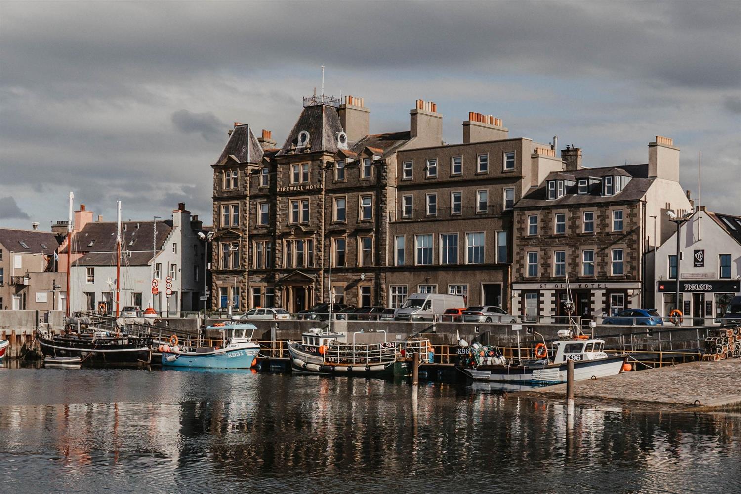 Front of Kirkwall Hotel in Orkney with boats on harbourside
