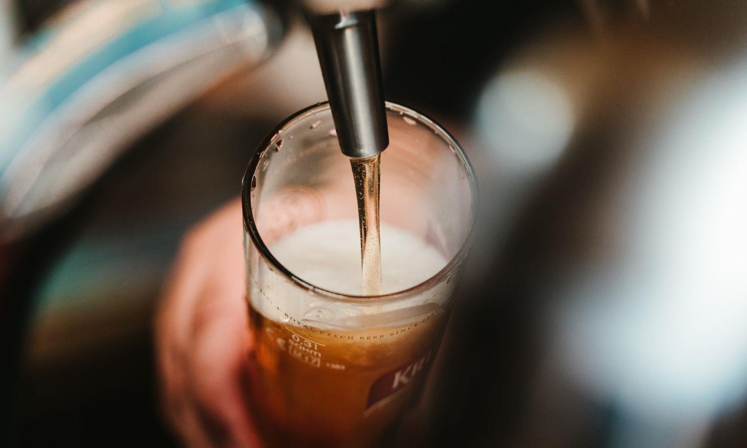 Close-up of pint of ale being poured