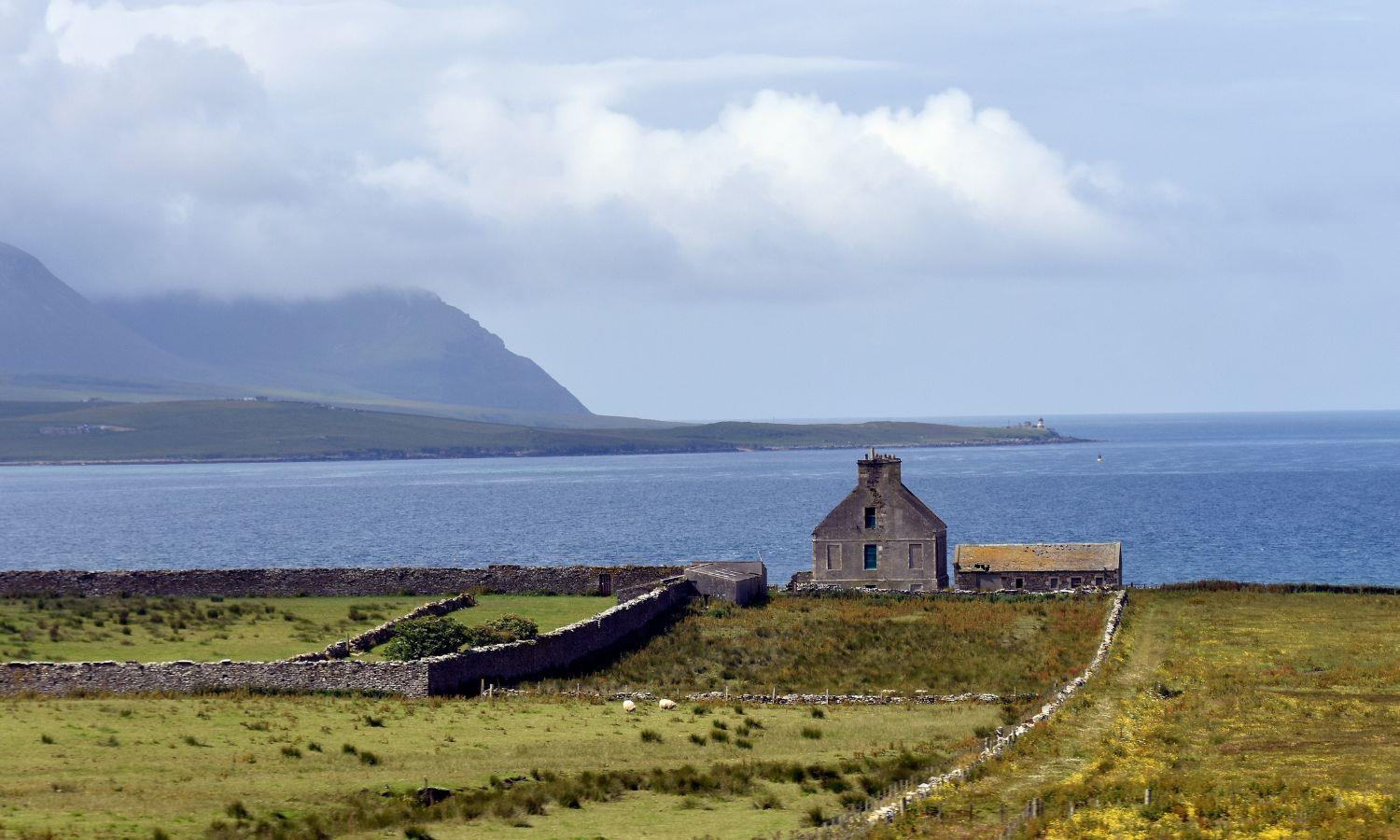 orkney coastline with house