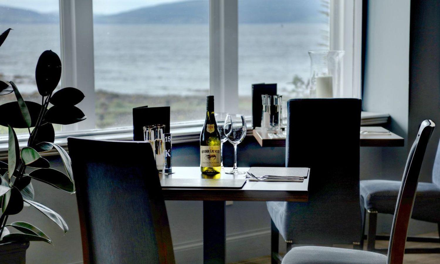 Restaurant dining table with sea views across the Kilbrannan Sound at Kinloch Hotel, Isle of Arran