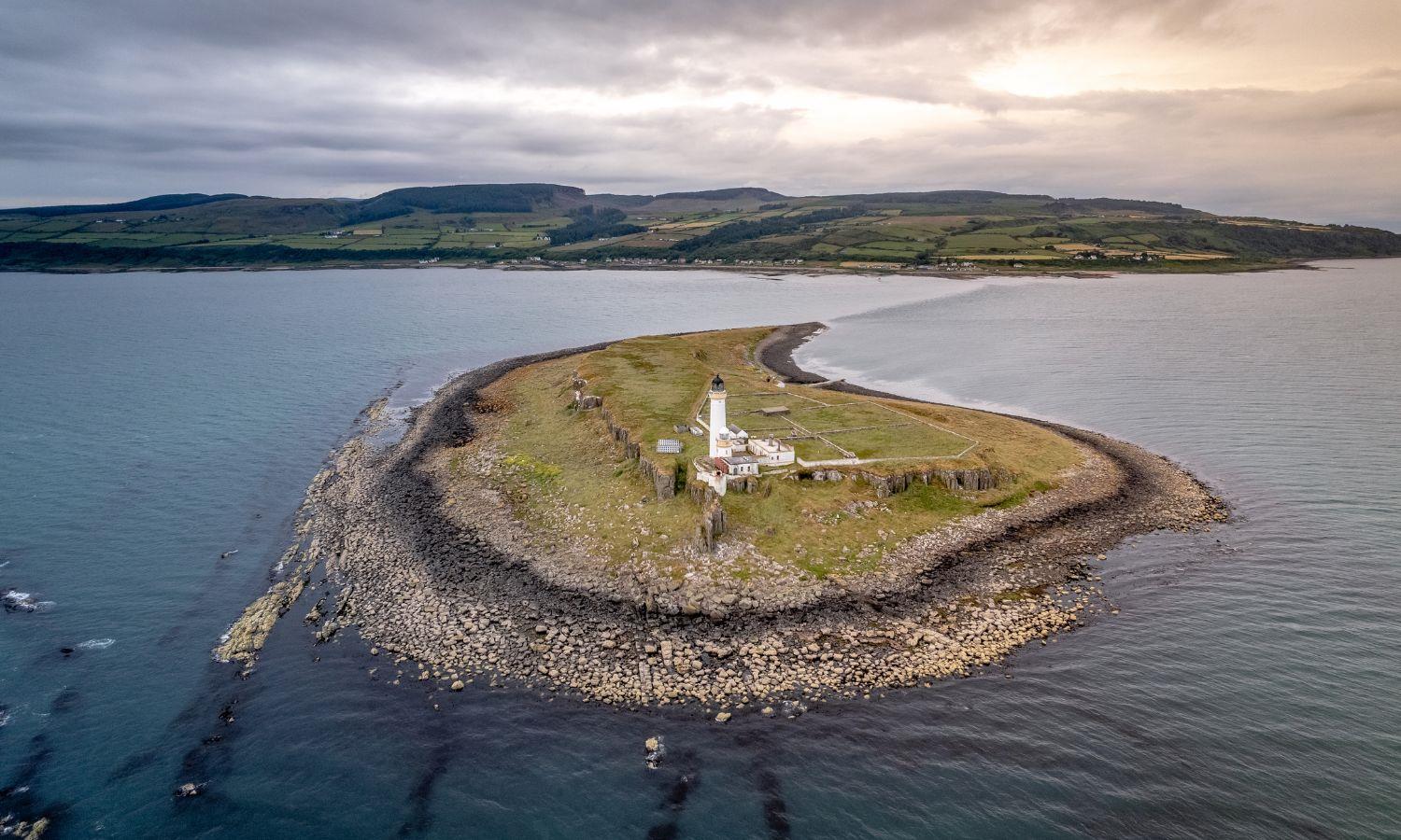 Aerial view of Pladda Island lighthouse off the south coast of the Isle of Arran