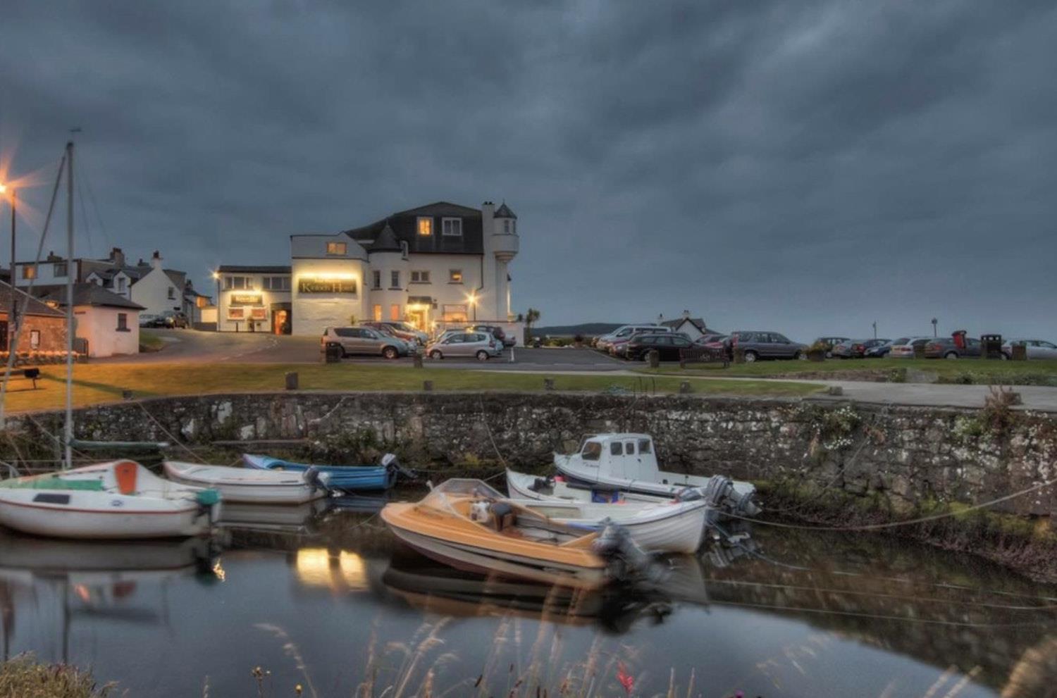 Kinloch Hotel from the water, at dusk. 