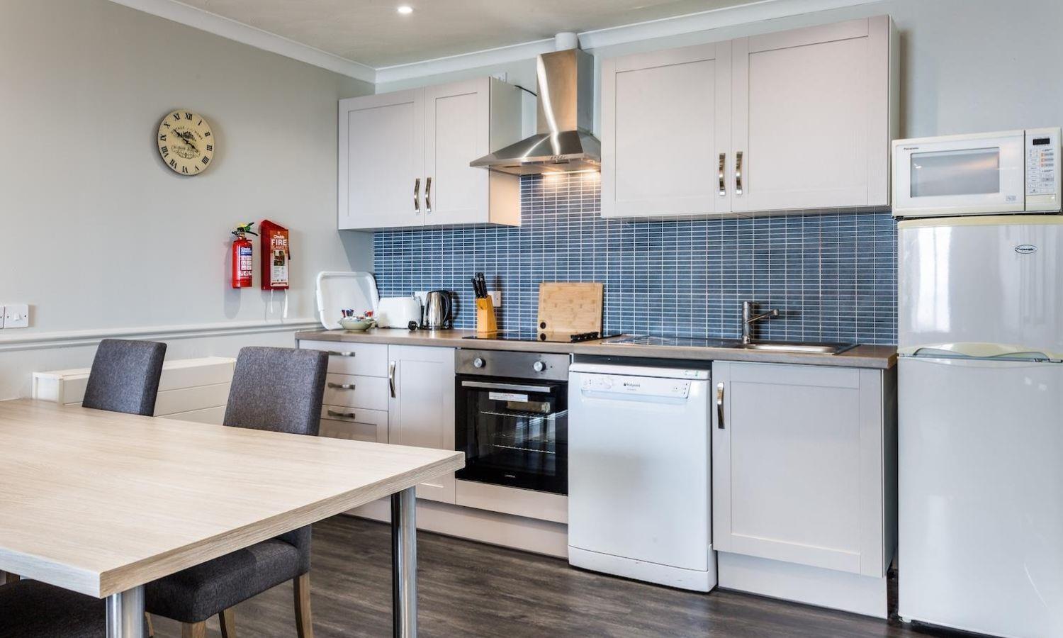 Kitchen with dining table in self-catering apartment