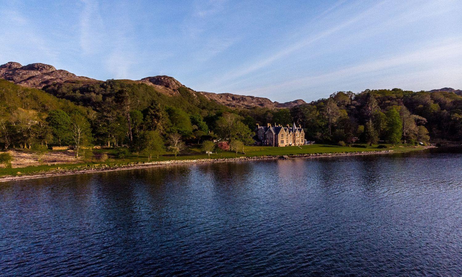 View across Loch Gairloch towards Shieldaig Lodge - a hotel in the West Highlands of Scotland